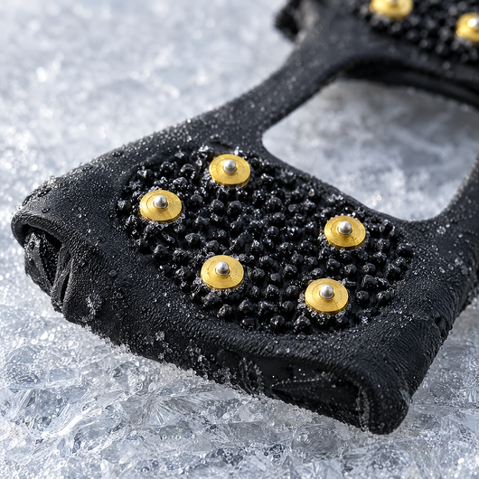 Close-up of the steel studs on ice