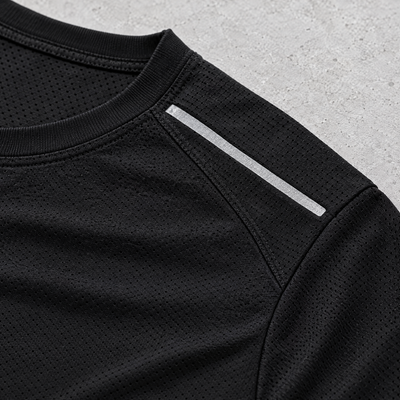 Close-up of the shoulder seam and reflective detail