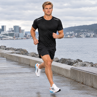 Man running along the waterfront in the quick-dry running t-shirt