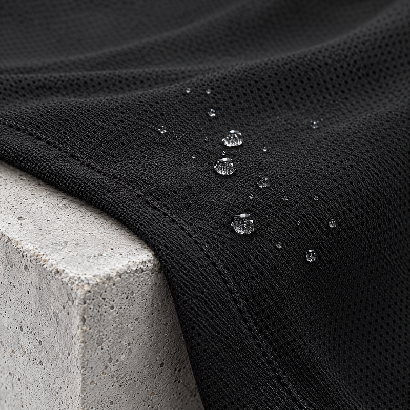 Macro of quick-dry running t-shirt fabric with water droplets