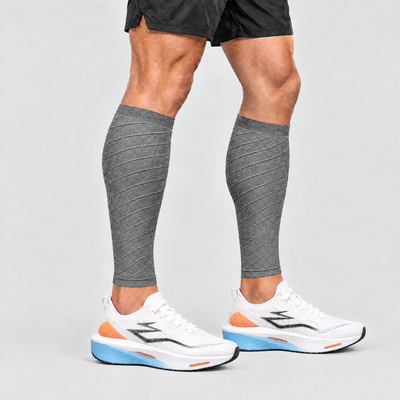 Runner wearing grey calf compression sleeves