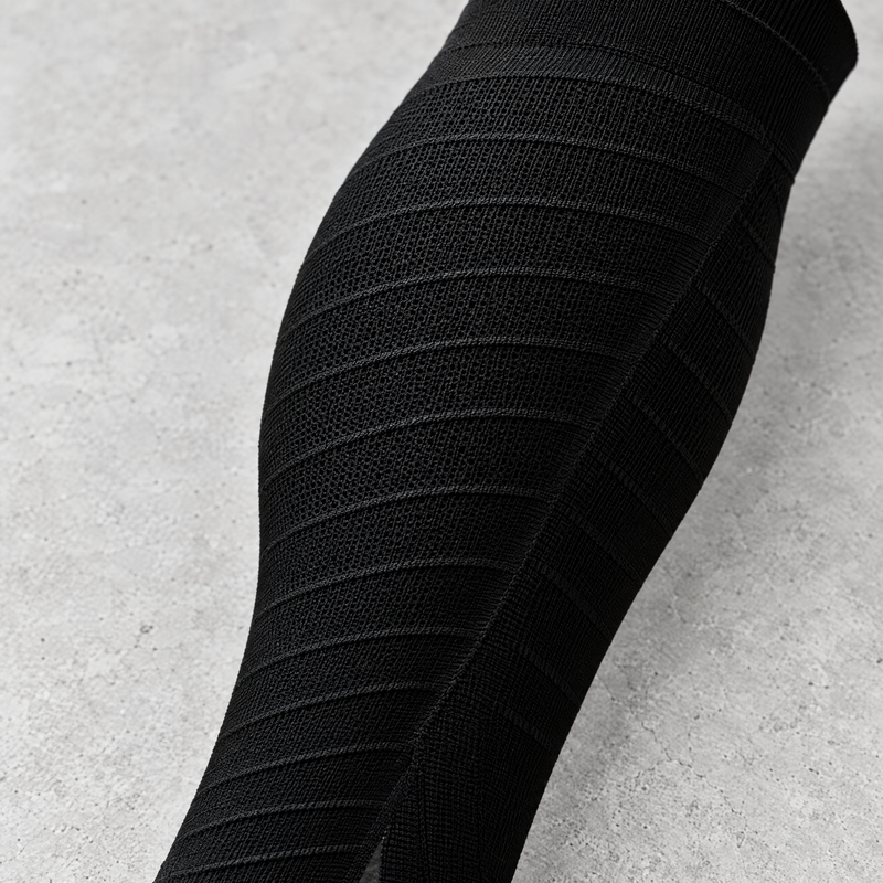 Close-up detail of the calf compression sleeves