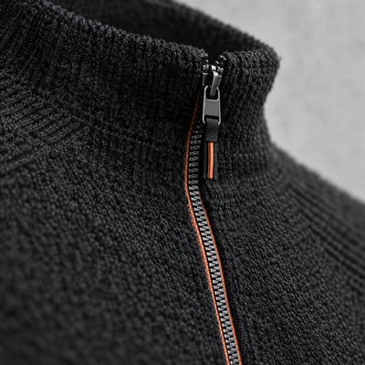 Close-up detail of the half-zip running top