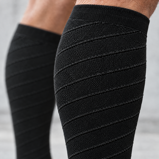Close-up detail of the calf compression sleeves