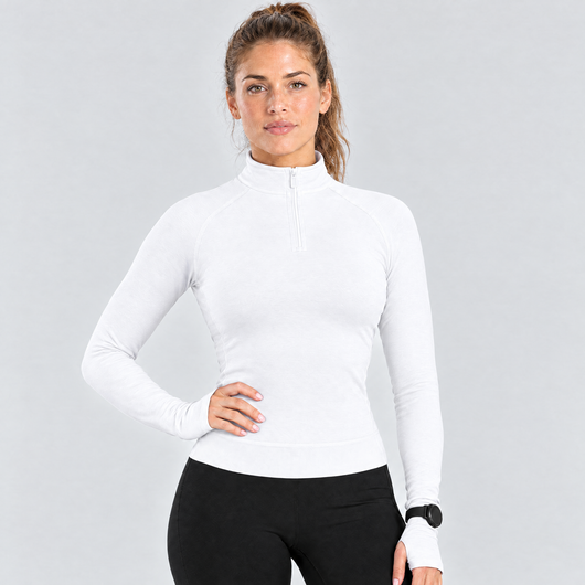 Woman wearing the white half-zip running top