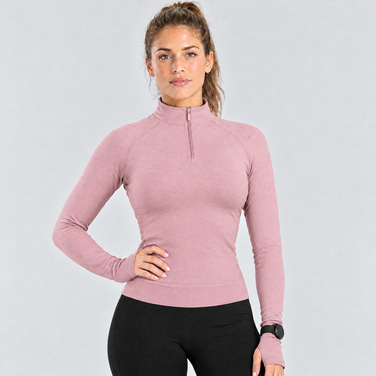 Woman wearing the pink half-zip running top