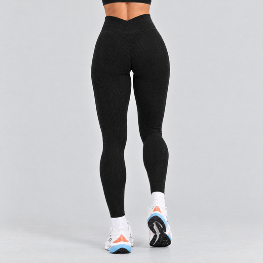 Black seamless running tights seen from behind